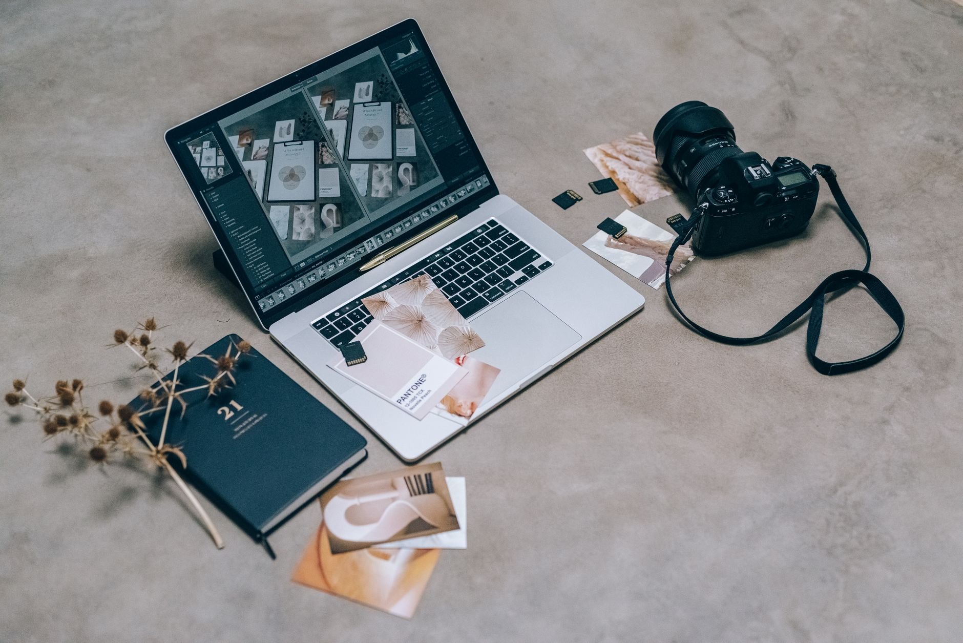 Creative workspace featuring design materials and tools for digital artists